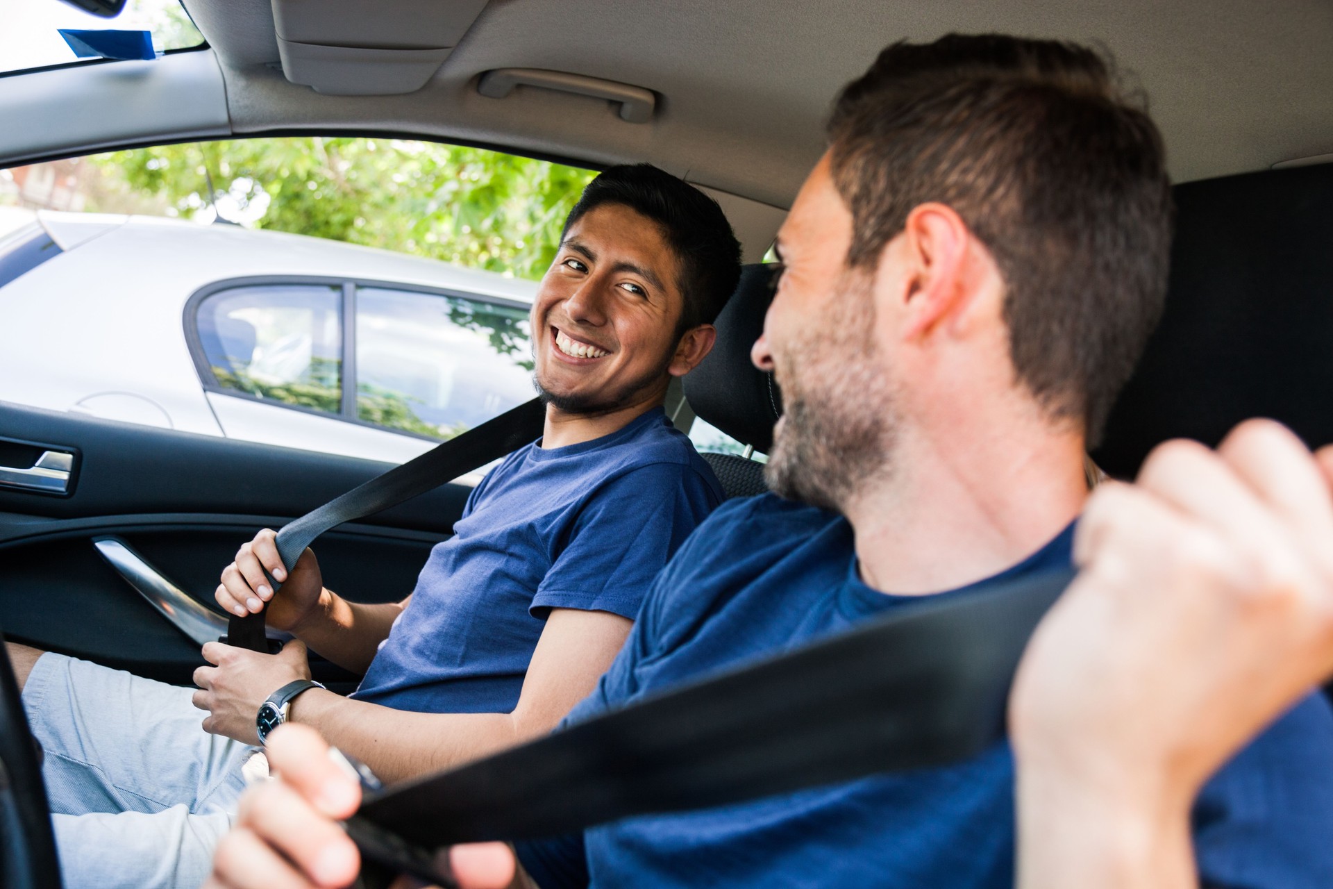 Friends fasten seat belt before leaving for vacations