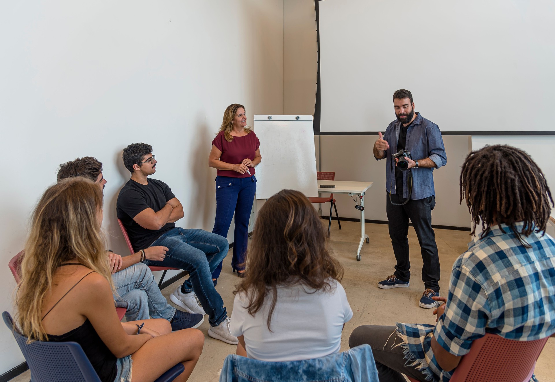 Group of young Brazilians in a room during a photography class